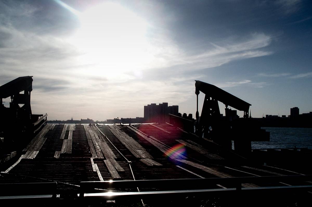 An old ship dock at Detroit River, the Sun directly pointing towards the camera