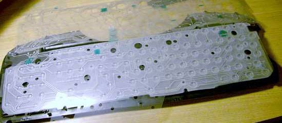 The **contact board**, containing 3 layers; two with circuits, one separating them