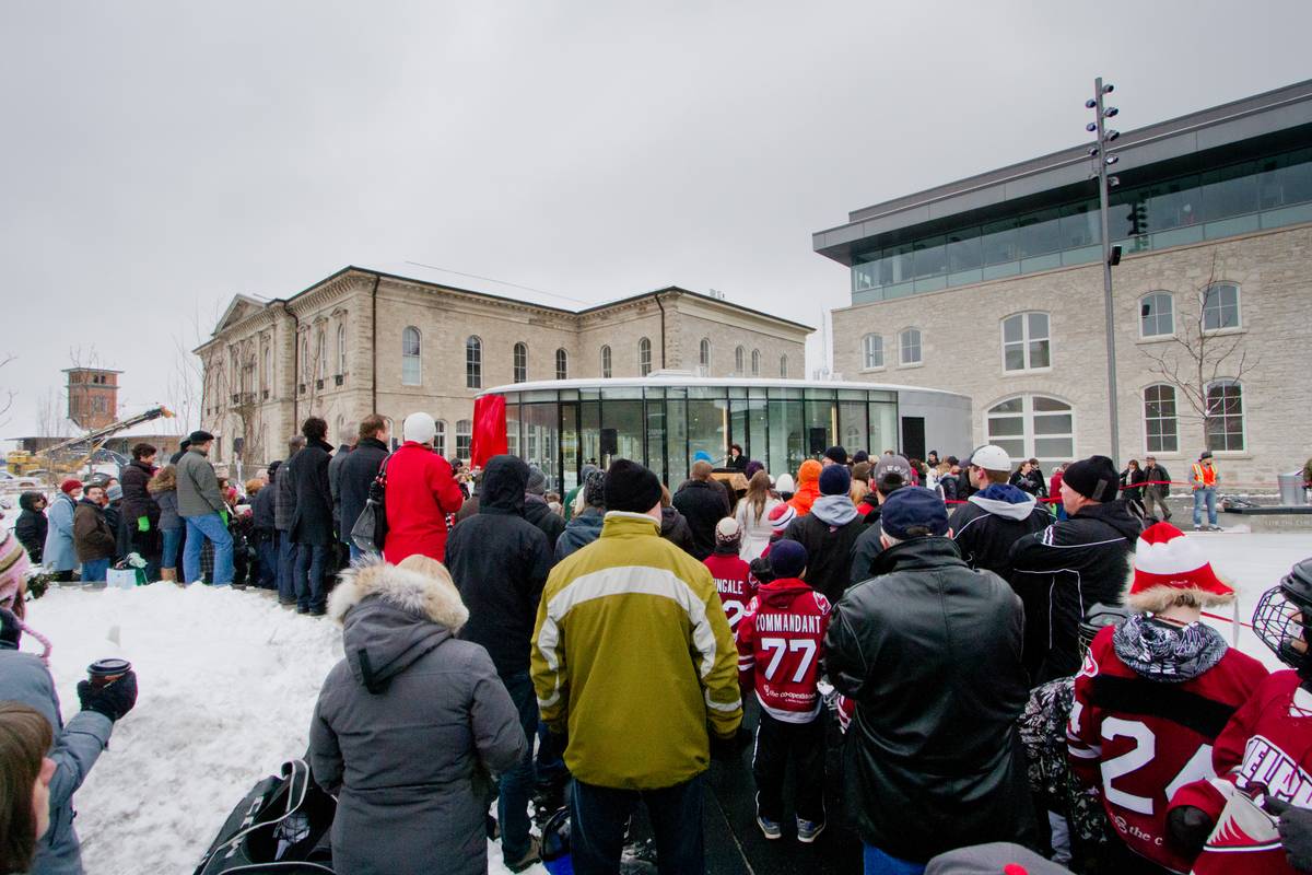 A crowd gathered in front of the a stage where Mayor Karen Farbridge gave her opening speech, which the crowd received with muffled, though enthusiastic, applause.