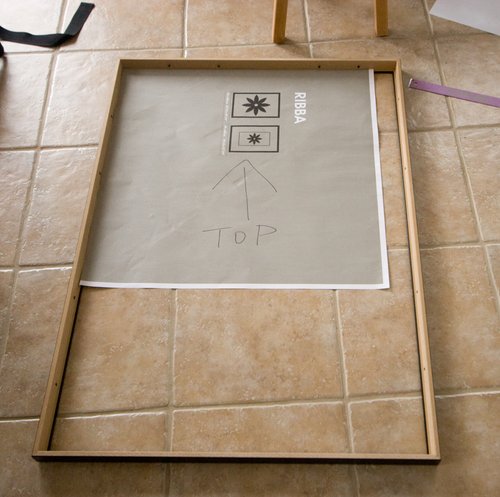 A paper template laid inside the virgin frame