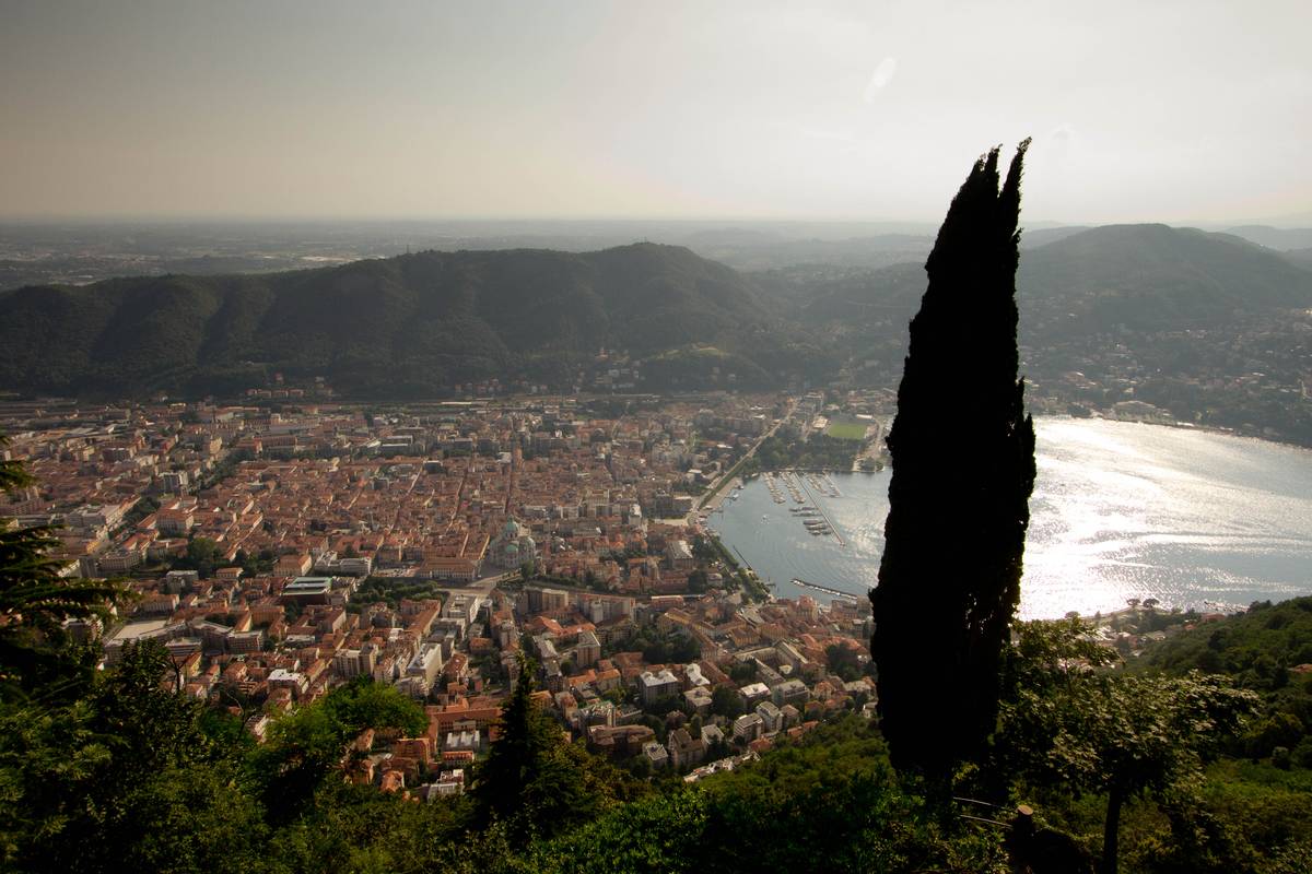 An aerial view of Como from the hilltop town of Brunate. Roman influence on the city center's plan is evident. The cathedral (duomo) is visible towards the middle of the photograph.