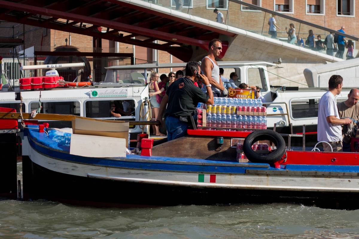 Workers bringing in supplies into Venice using the best transport available for that purpose – boats.
