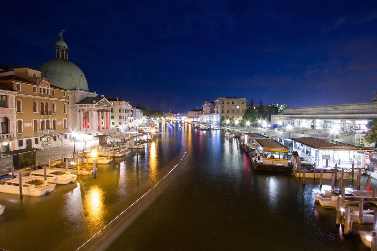A view of the Grand Canal from *Ponte degli Scalzi* with the *San Simeone Piccolo* visible to the left and railroad  to the right.