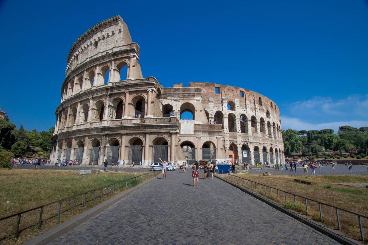 The Colosseum as viewed from (IMO) best angle with less tendency for lens distortion and no obstacles. The marble façade originally encircled the ampitheatre. Half was quarried away over the centuries leaving both ends reinforced with bricks