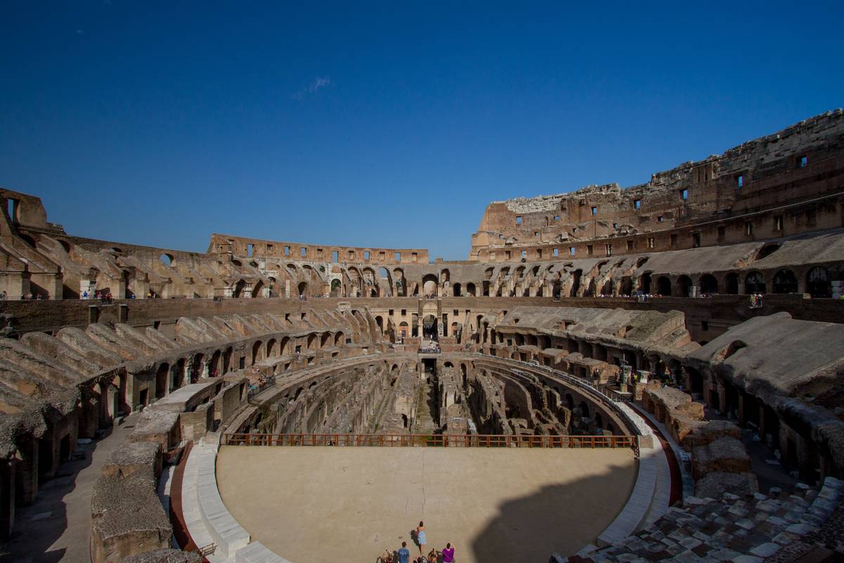 Inside the Colosseum with a third of the arena reconstructed covering the *hypogeum* below, a dungeon housing gladiators, animals and props