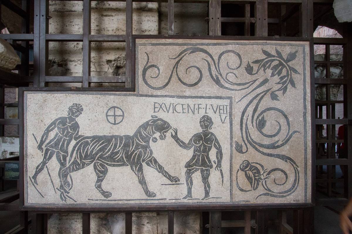 A mosaic depicting a fight between two women and a tiger. The woman on the right appeared to have won (a 