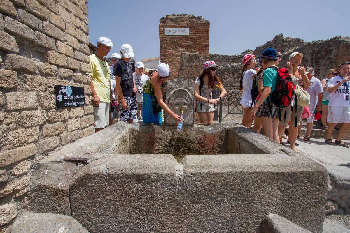 Fresh drinking water available at the intersection of Via dell'Abbondanza and Via Stabiana, once supplied by an aqueduct