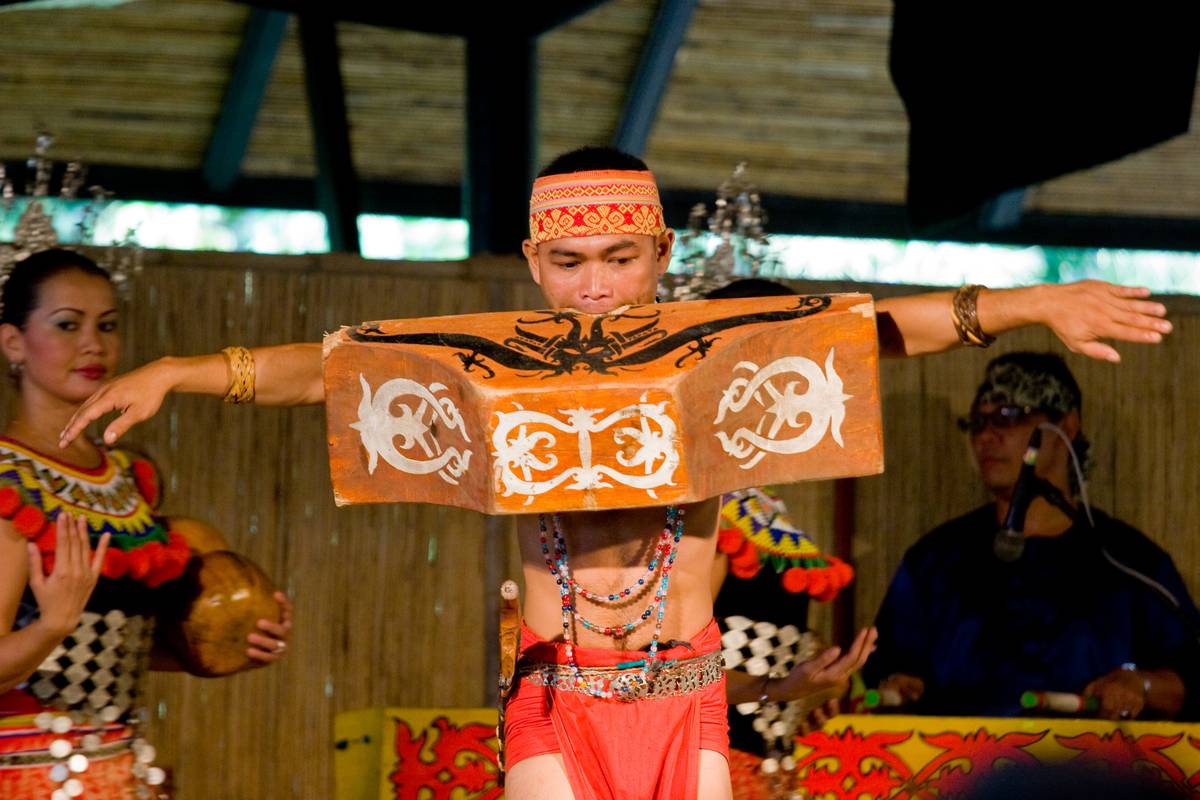 A traditional dance celebrating the return of victorious warriors. The block of wood the performer seen biting on below weighed 20kg.