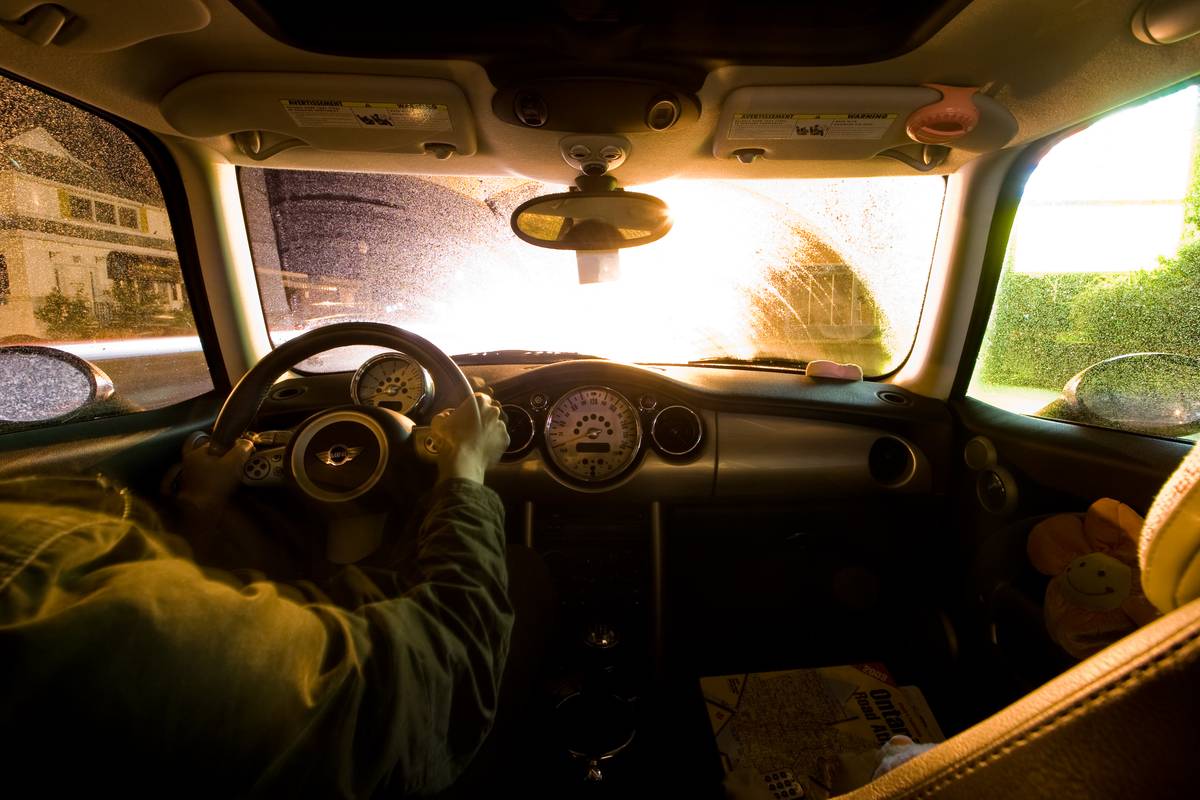 Inside a MINI Cooper 2006. Shot at night, the drizzle beads up on the windows, creating a fractal effect when downtown lights shine through them.
