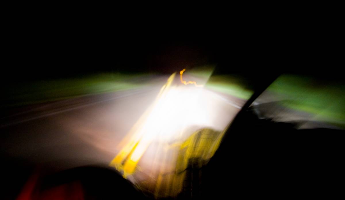 1. Drive the car as usual. 2. Wind down the window. 3. Steer with your right hand. 4. Hold the Canon 20D out the window with the left hand. 5. Release the shutter. 6. Thank your diety of choice for not destroying the camera