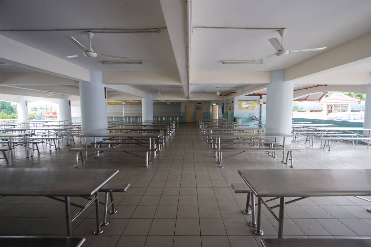 To meet demands for higher student enrolment, the original one-storey cafeteria was torn down and rebuilt with a 5-storey office building on top of it.