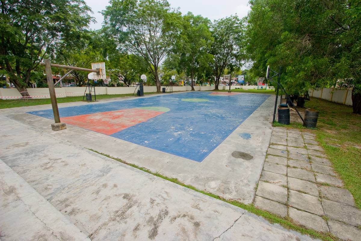 Another basketball court at the end of the field.