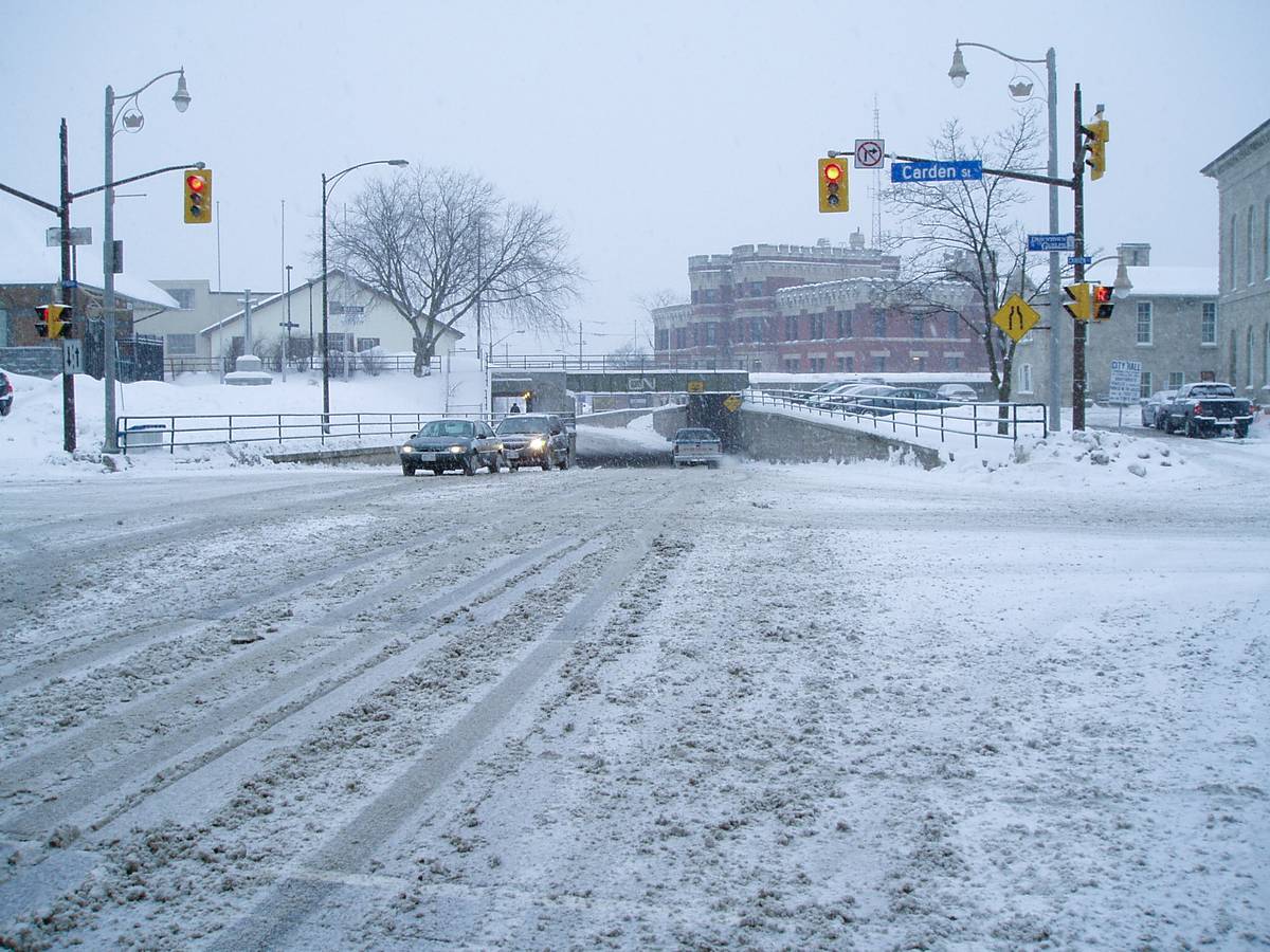 Snow all over the crossing of Carden and Wyndham Streets in Guelph