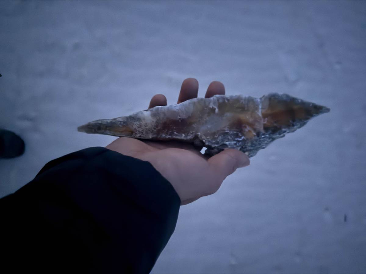 A rock sample from which the white sands originate through erosion