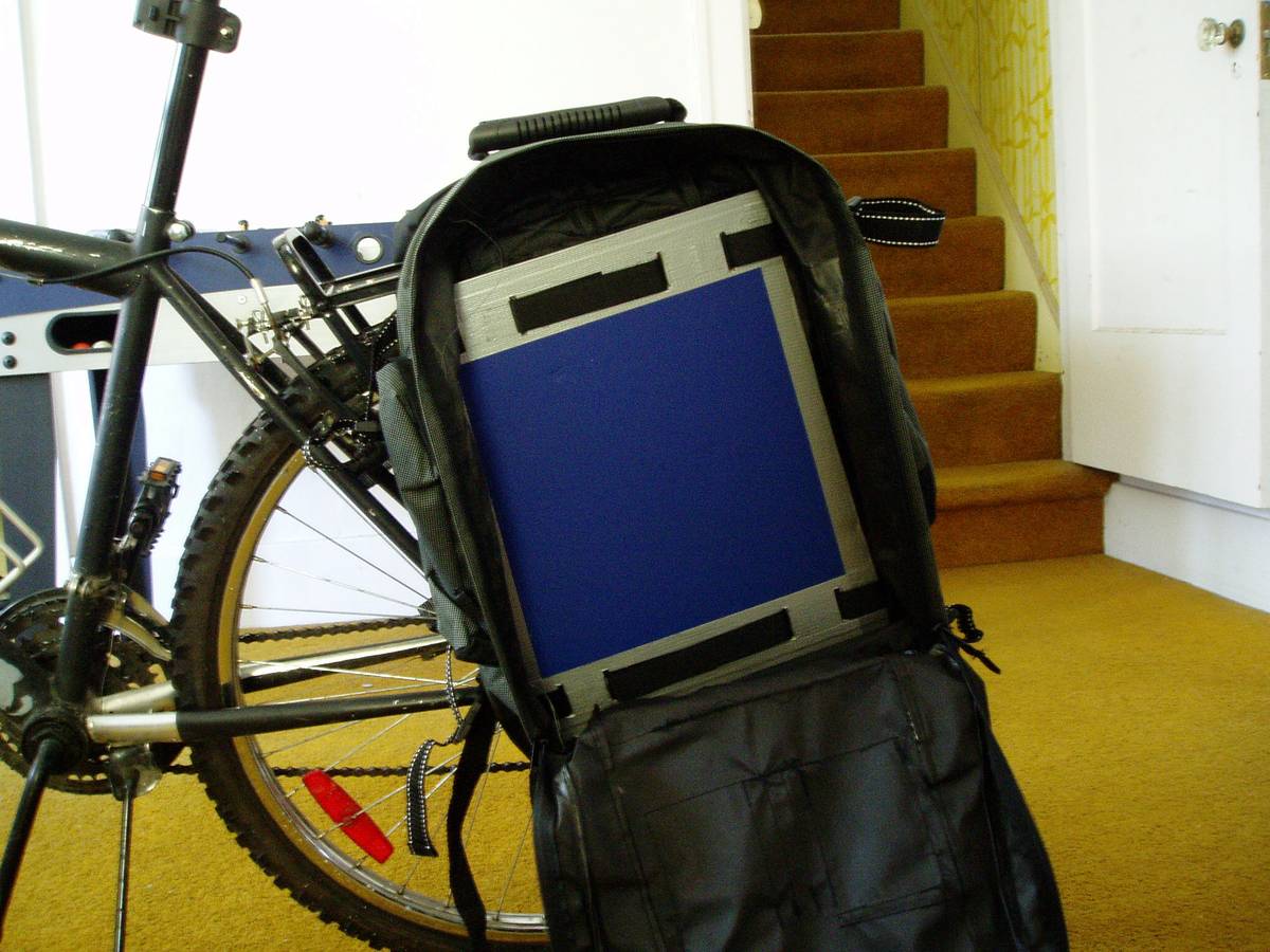 **Figure 3** Poster boards held onto the back of the backpack creates a stiffer back