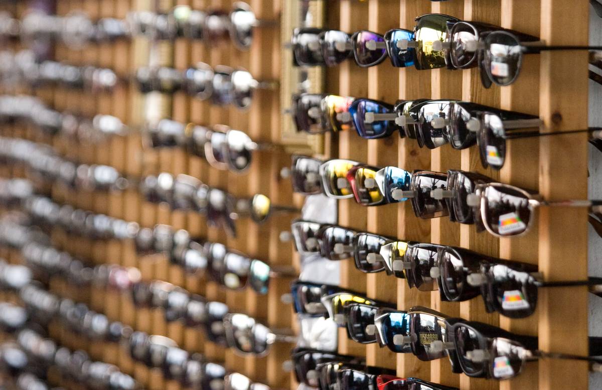 Hundreds of cheap sunglasses for sale outside the market.