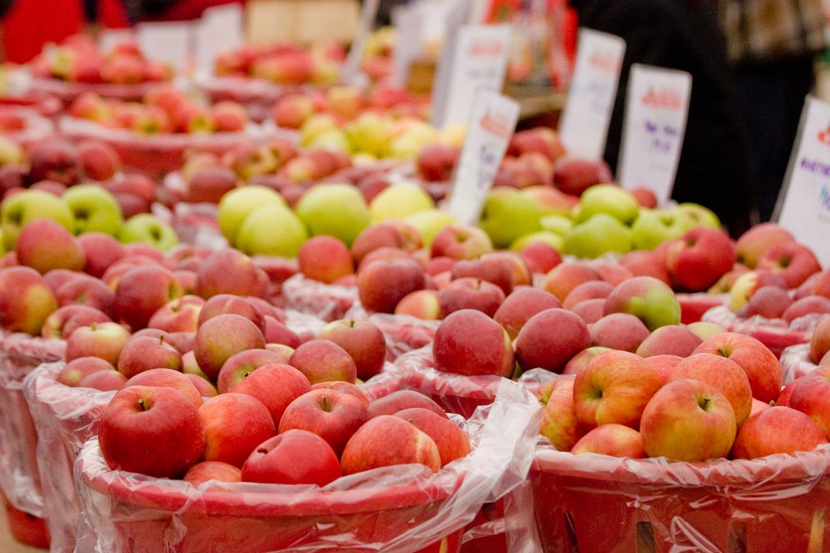 Baskets of apples for sale outside the market.