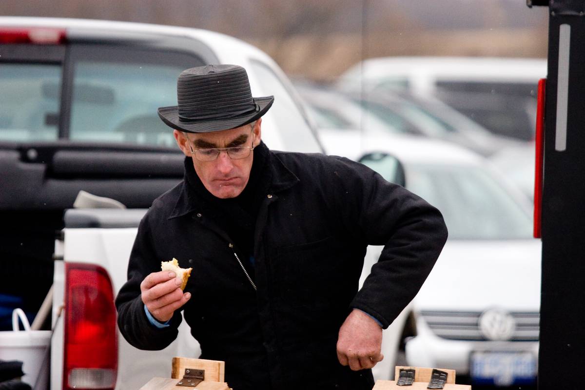 An Amish man selling maple syrup, St. Jacobs traditional product.