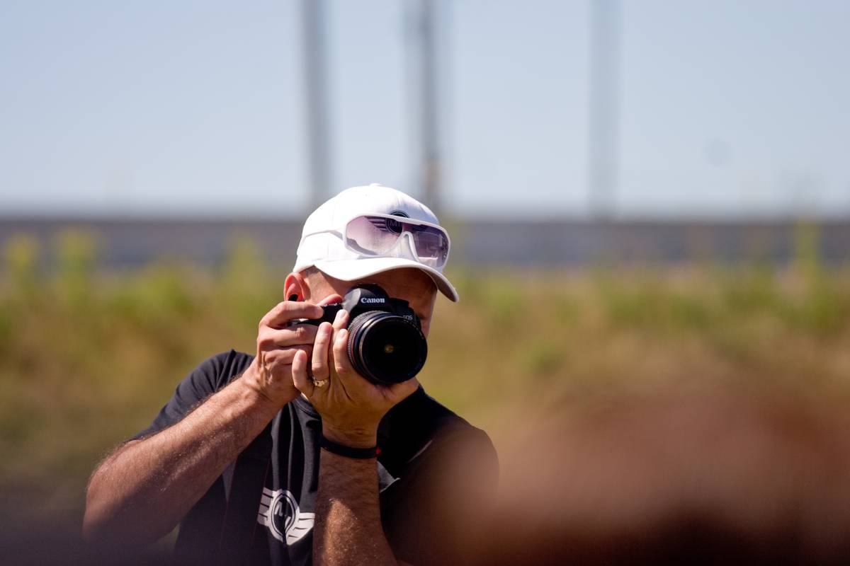 One of the organizers taking a group photo of MINI 