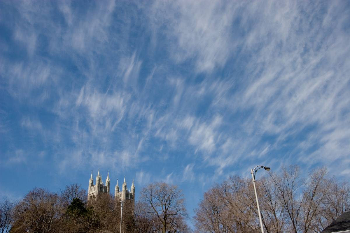 High altitude cirrus clouds above the towers of Church of Our Lady.